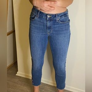 Levi jeans with embroidered flowers.